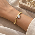 Gold-Tone Open Cuff Bracelet with Clear Drop Charm